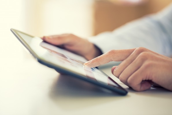 Woman using digital tablet indoor